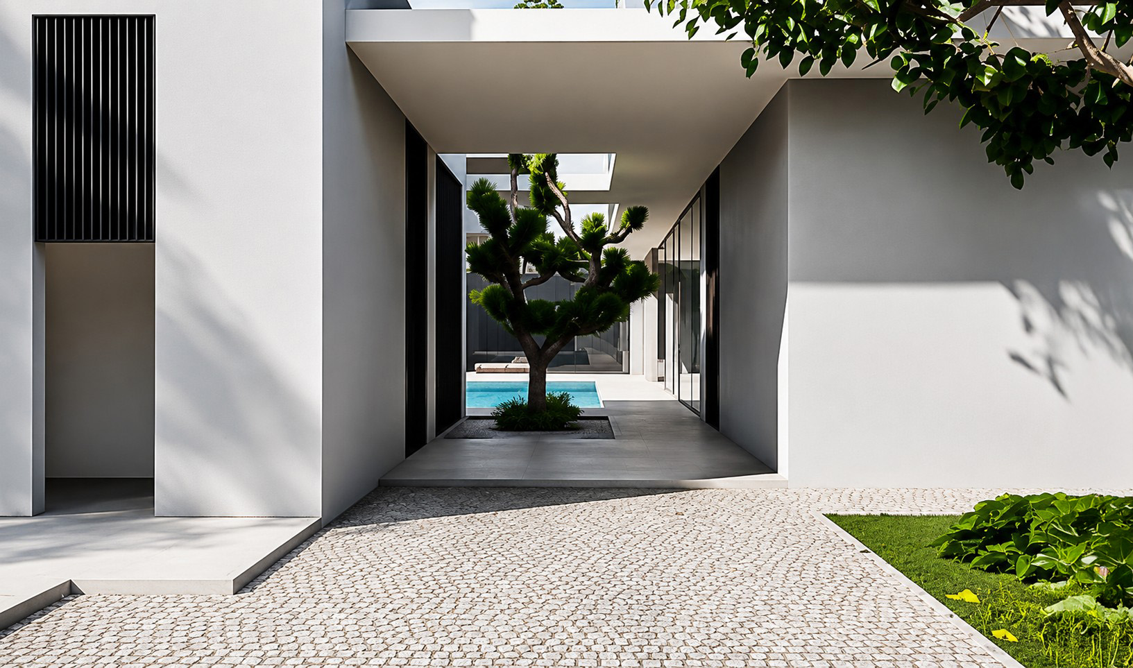 Courtyard Villa exterior with framed glazing and garden