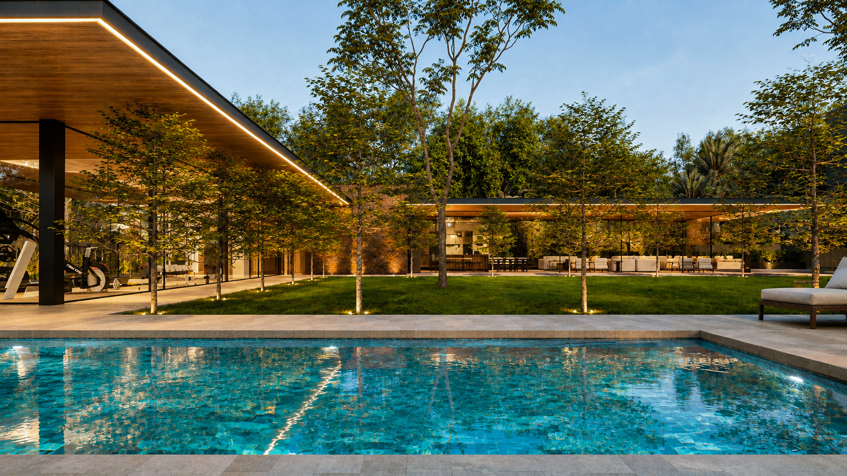 Swimming pool and pavilion across the illuminated garden